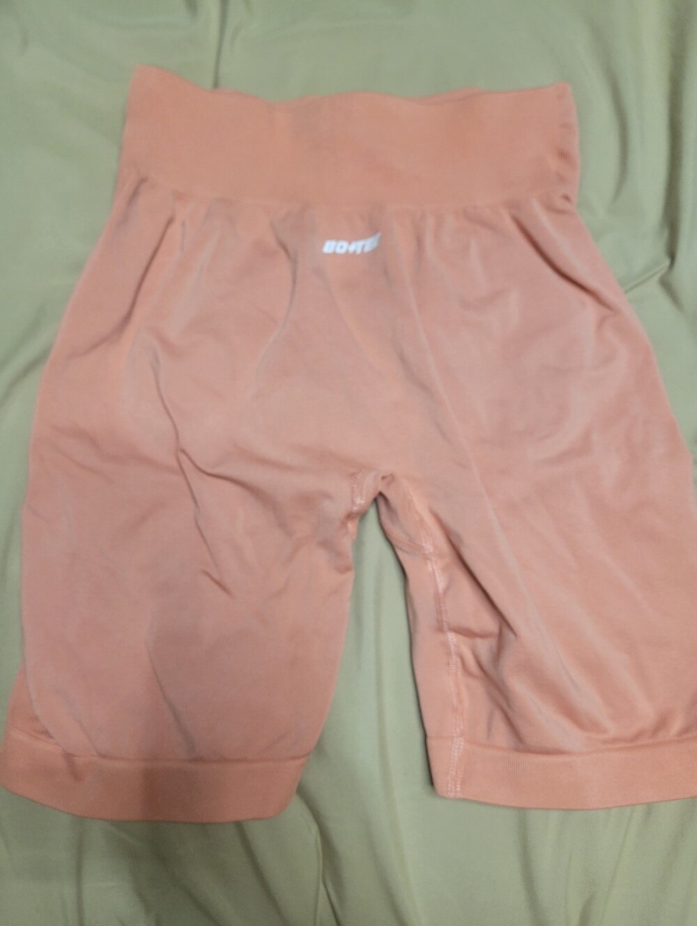 peach Bo+Tee seamless workout shorts.